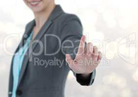 Midsection of businesswoman using imaginary screen