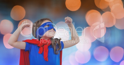 Girl in super hero costume over blur background