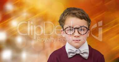 Cute boy wearing eyeglasses against blur background