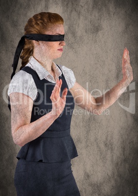 Business woman blindfolded with grunge overlay against brown background