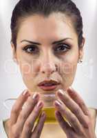 Close up of woman drinking tea against white background