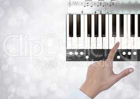 Hand Touching Piano keys with notes and effects App Interface