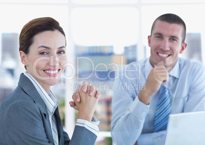 Portrait of confident business people smiling in office