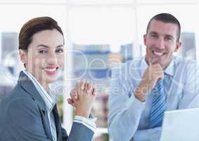 Portrait of confident business people smiling in office