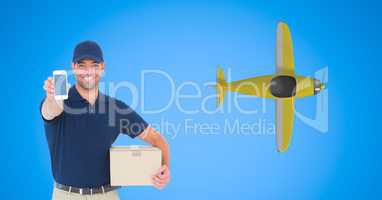 Delivery man showing smart phone with airplane flying in background