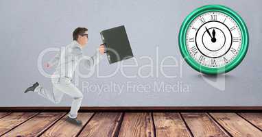 Businessman carrying briefcase while running late with clock in background