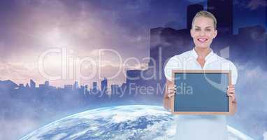 Businesswoman holding blank slate with globe and buildings in background