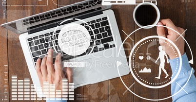 Top view of hands with laptop and coffee on tablet table