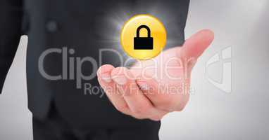 Close up of business man hand with yellow lock graphic and flare against white background