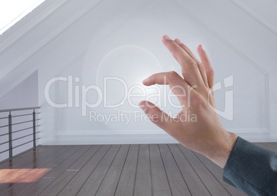 Hand touching air in empty room