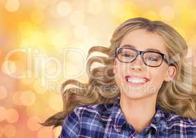 Cheerful woman wearing eyeglasses over bokeh