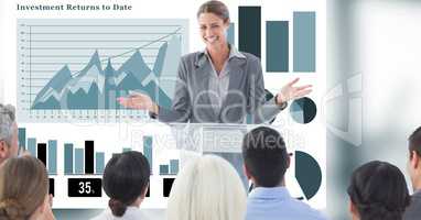 Businesswoman giving presentation to colleagues with graphs in background