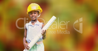 Boy pretending as architect holding blueprint over bokeh