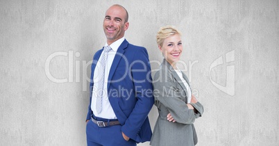 Portrait of confident business people standing against gray background