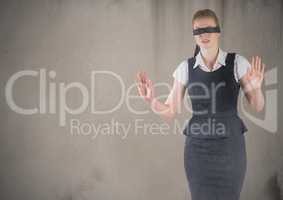 Business woman blindfolded with grunge overlay against brown background