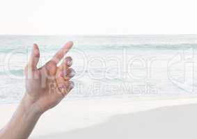 Hand touching  air with  sea horizon