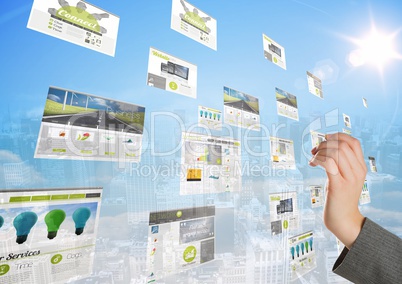 panels with websites (green) in front of the city, hand