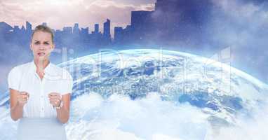 Digital composite image of woman with clenched hands against earth