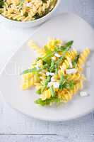 Pasta salad with asparagus and arugula