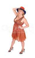 Pretty woman in dress and hat.