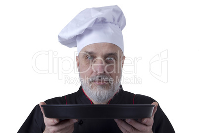 Bearded chef with tray in hands
