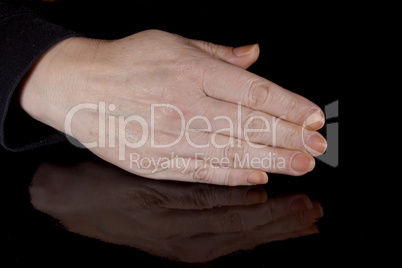 Female hand and its reflection