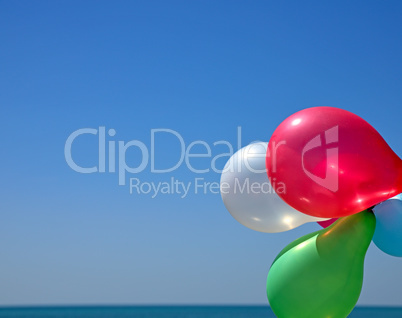 Multicolored balloons against the blue sky