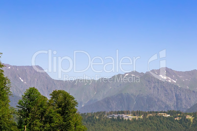 The mountainous landscape of the slopes covered by forest.