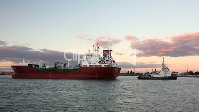 Tug moves LPG tanker ship Kappagas around the harbor, Bremerhaven, Germany
