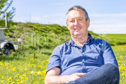Man enjoys the leisure time in a flower meadow