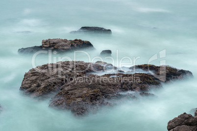 Long Exposure Of Waves and Rocks in the Pacific Ocean.