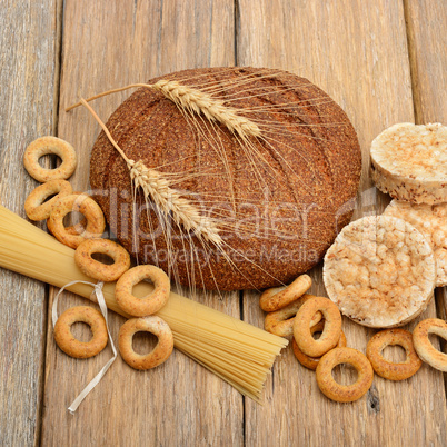 bread, pasta and pastries on wooden surface