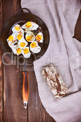 Fried quail eggs in a frying pan