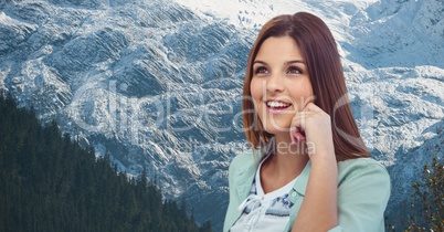 Smiling woman against snowcapped mountain