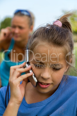 Happy girl while with mobile telephone