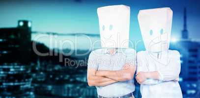 Composite image of couple wearing paper bags on head