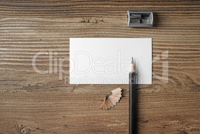 Business card, pencil and sharpener