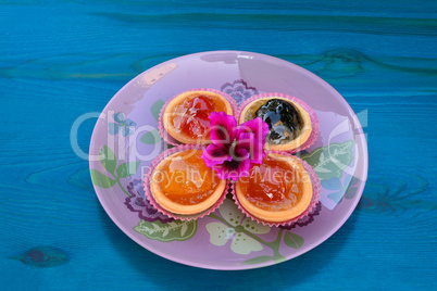Various candied fruits decorated with flower