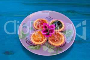 Various candied fruits decorated with flower