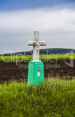 small cross by the road