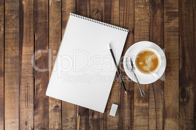 Notebook and coffee cup