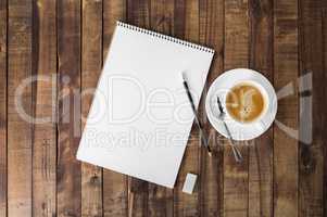 Notebook and coffee cup
