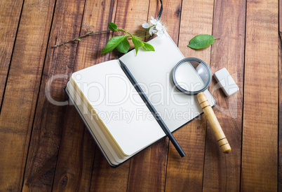 Notebook, magnifier, pencil