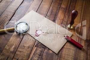 Envelope, magnifier and seal