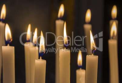 Burning candles on a black backg