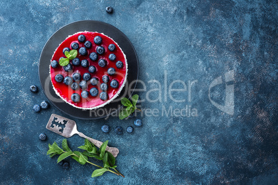 Delicious blueberry cake with fresh berries and marmalade, tasty cheesecake