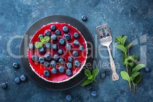 Delicious blueberry cake with fresh berries and marmalade, tasty cheesecake