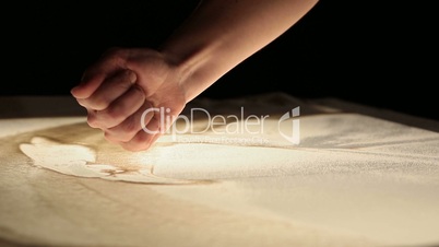 Sand animation. Hands of girl painting in the sand