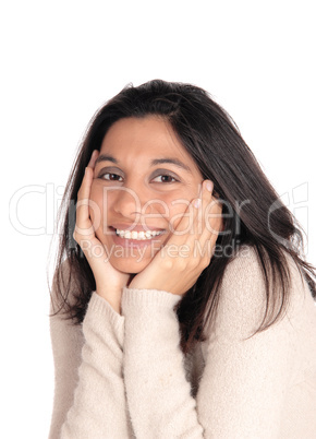 Happy woman holding her face in her hands.