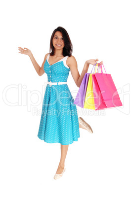 Beautiful Hispanic woman with shopping bags.